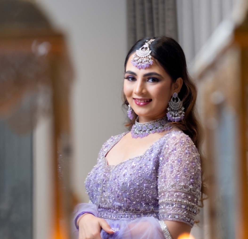 Bride in a lilac beaded outfit with matching jewellery